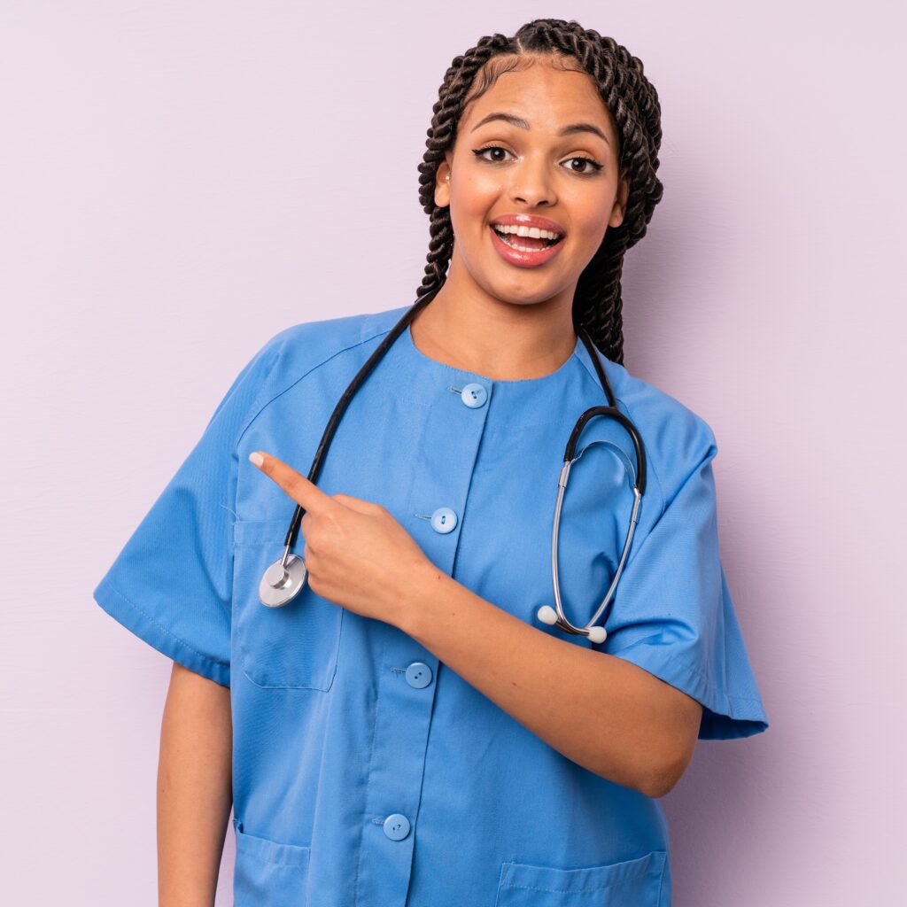 black afro woman looking excited and surprised pointing to the side. nurse concept